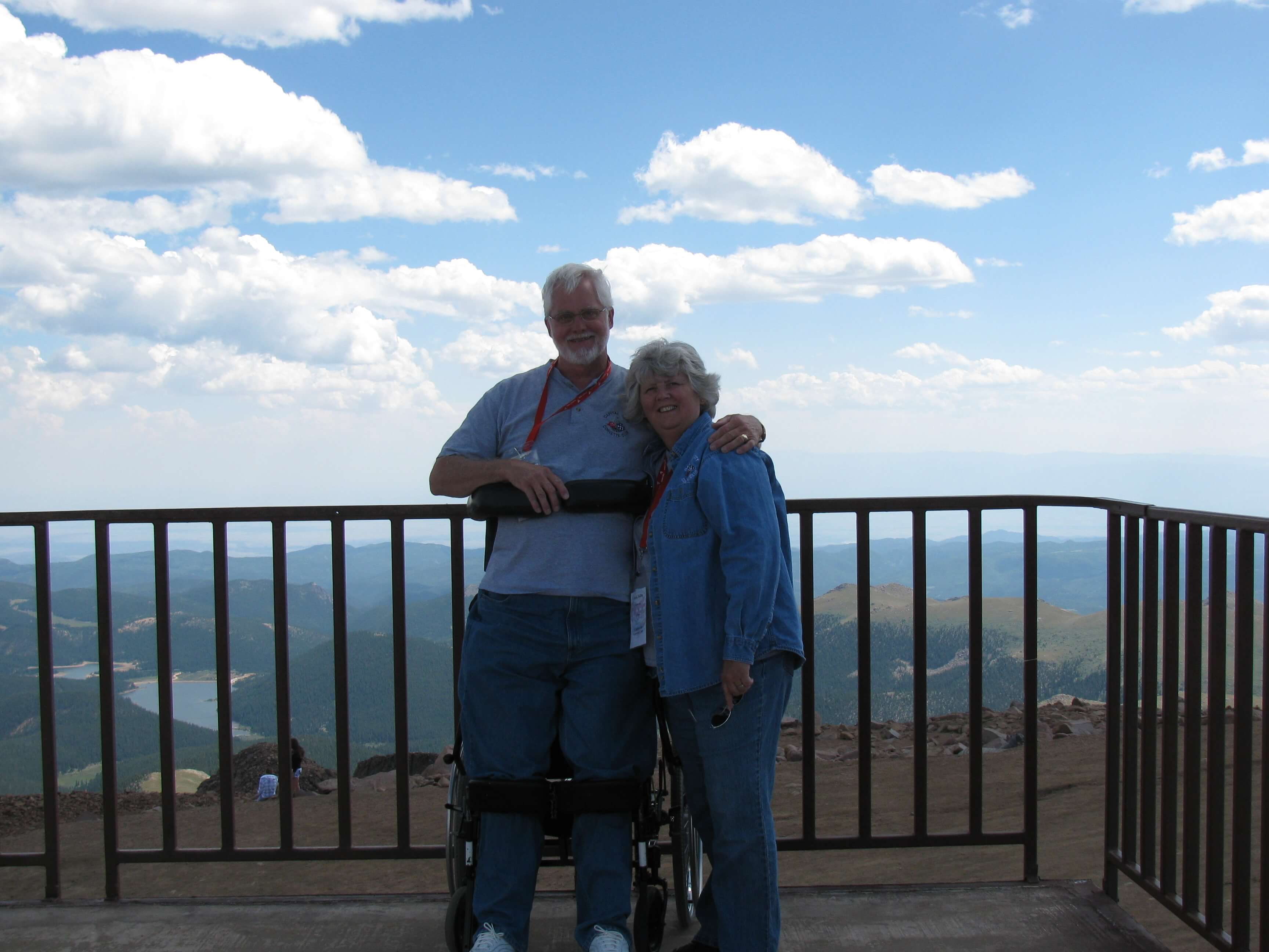 Image of Simon standing with his wife Gloria